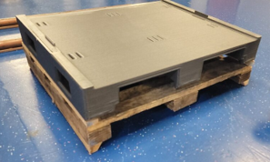 Plastic pallet on wood pallet
