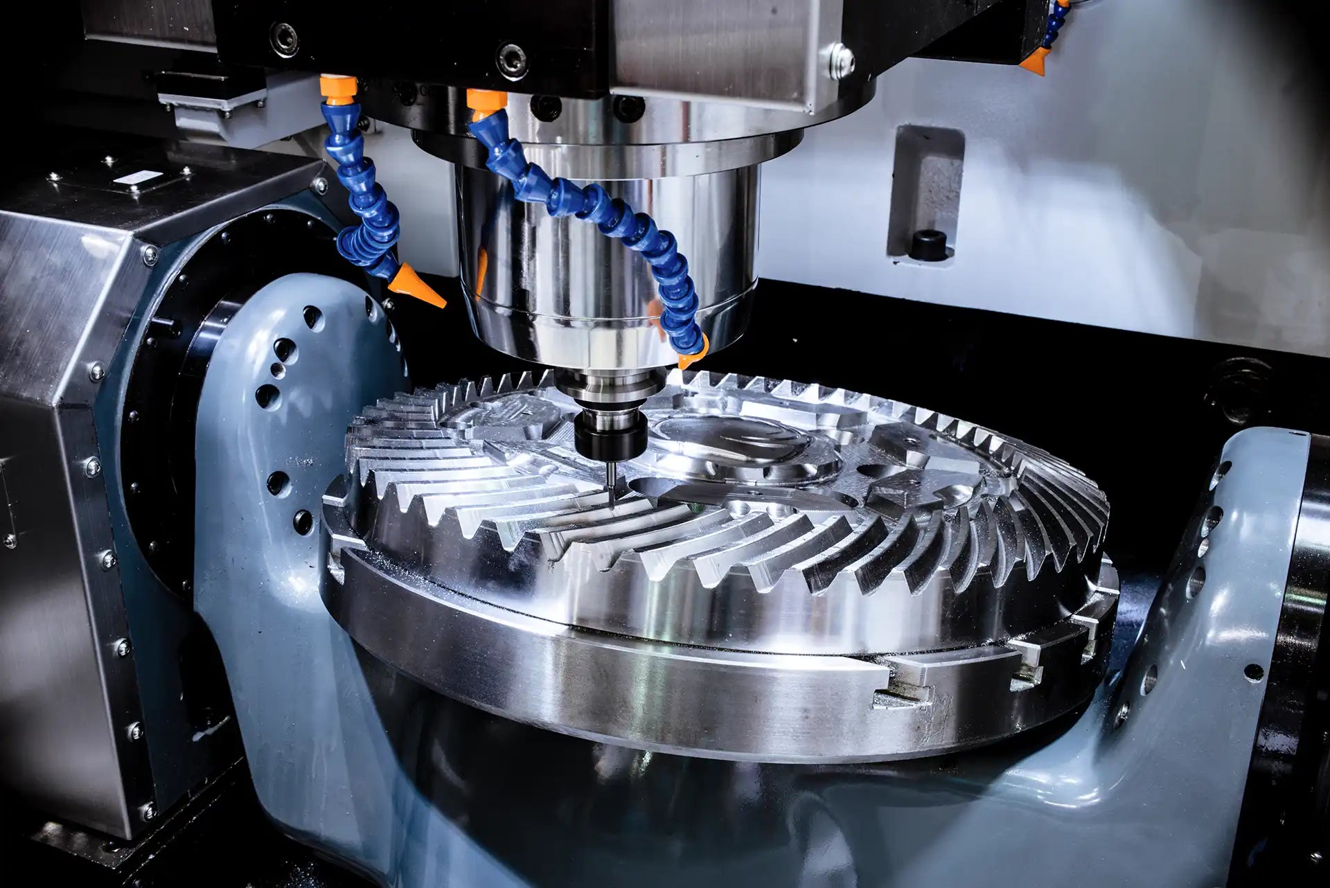 CNC machine cutting a metal gear component