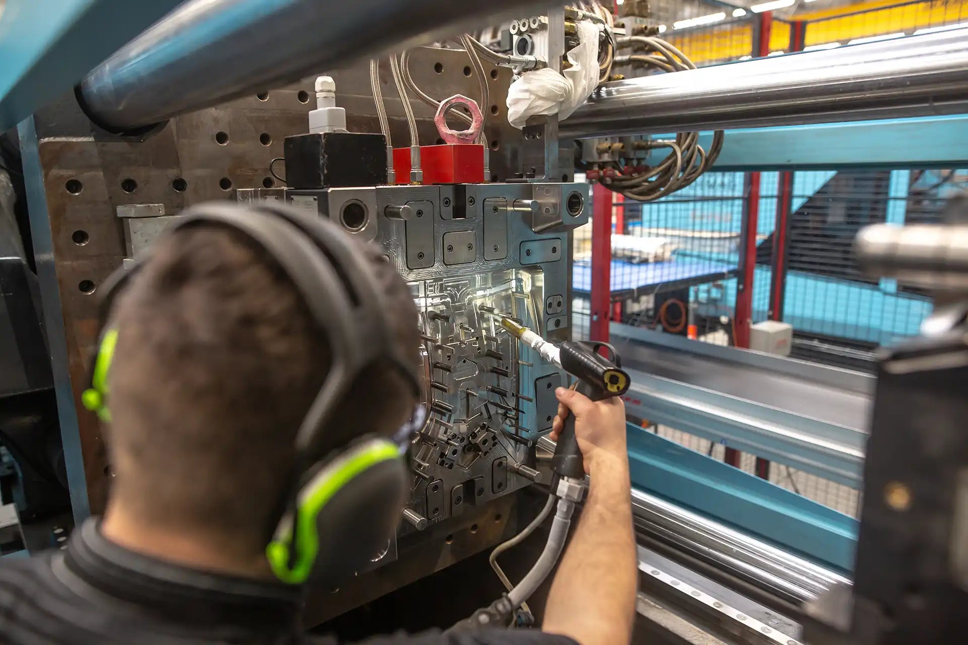 Person operating machinery in a factory setting