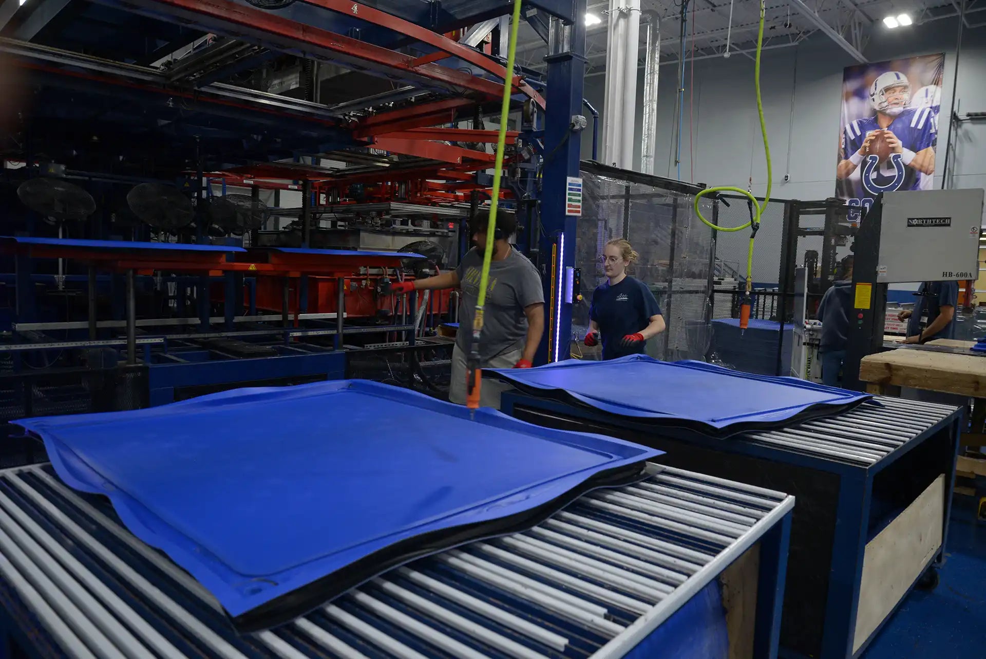Factory setting with blue materials on a conveyor belt